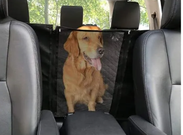 Golden retriever in back seat behind mesh window car seat hammock with storage pocket for pet travel