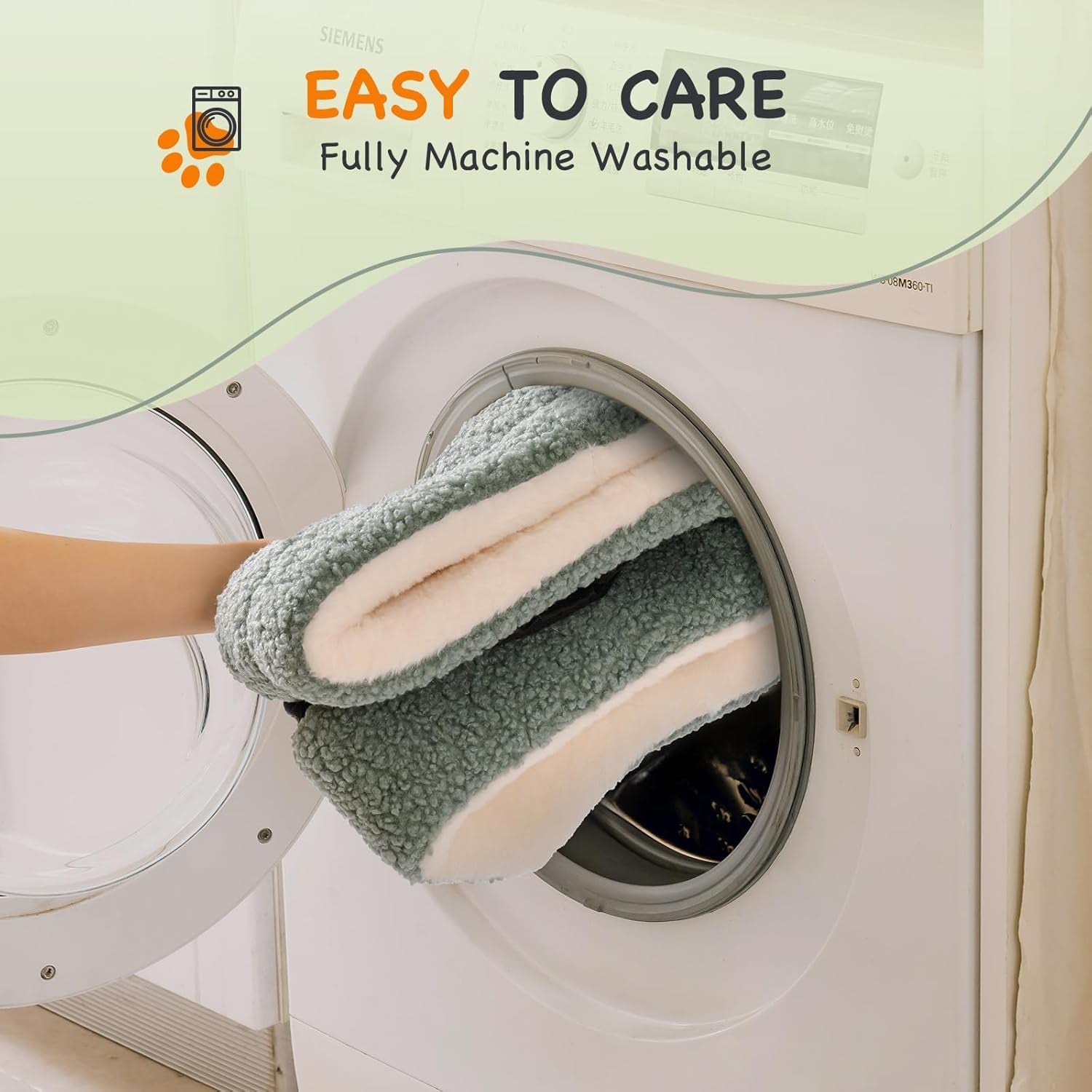 Machine washable round pet bed being placed in washing machine
